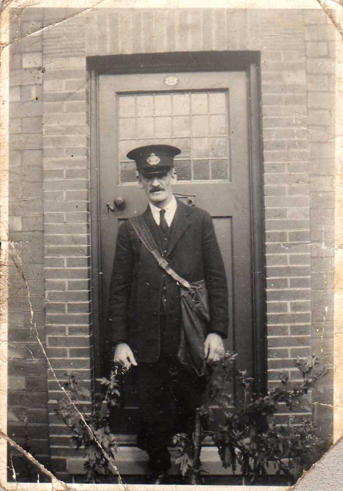 Photograph of resident in front of his entrance door